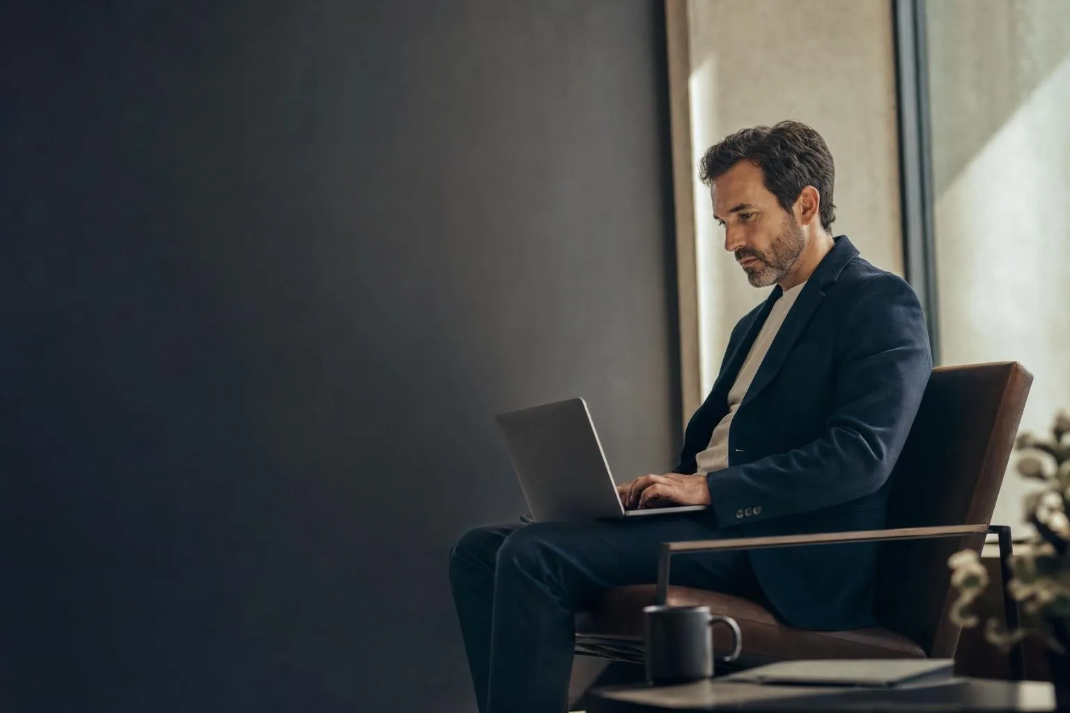 Cloud cost dashboards and spend charts on a laptop and monitor